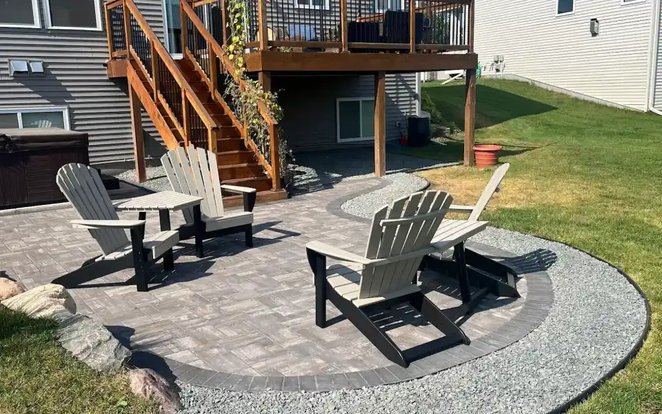 Curved paving stone patio with retaining wall in Edmonton