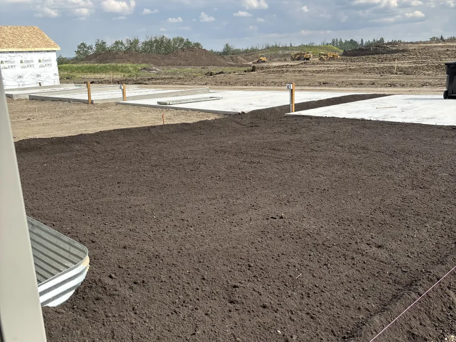 Professional final grading and topsoil leveling for a residential lot in Keswick, Edmonton.