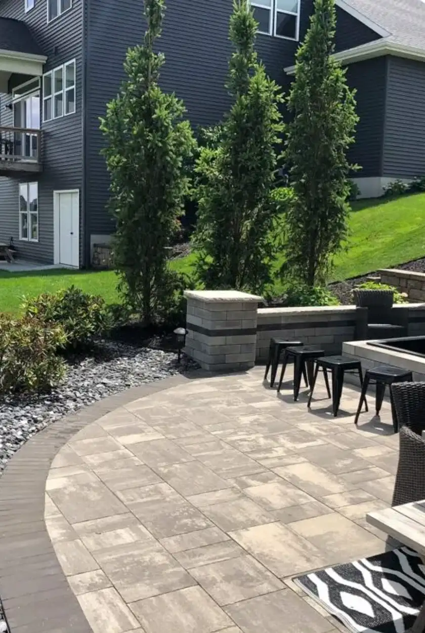Close-up of a newly installed interlocking brick patio with tight, level edges in Edmonton.