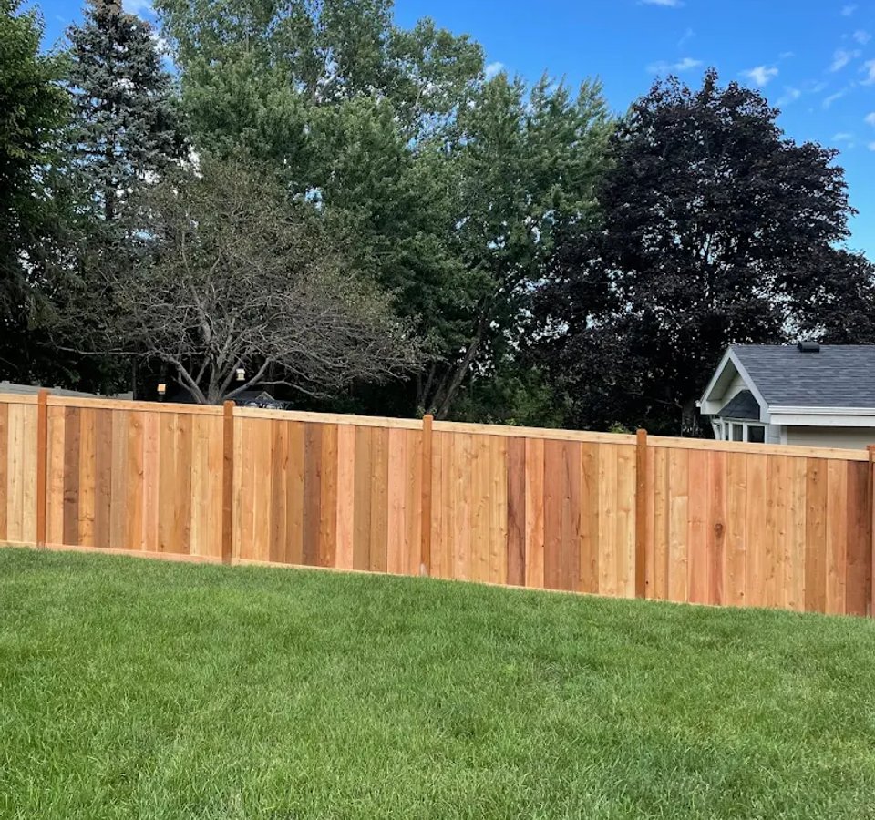Pressure-treated fence installation in Edmonton